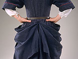 back view of dark blue linen gown showing how it ties up in the back