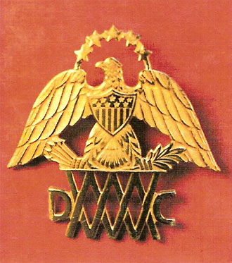 file:/activities/oralhistory/cappics/loving1941_insignia, alt: gold eagle pin for the Mass Women's Defense Corp
