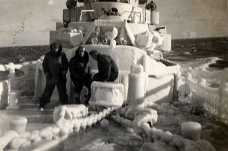 file:/activities/oralhistory/cappics/slater1942_life_ice, alt: 3 crew members aboard a snow encrusted USS Walter S. Brown